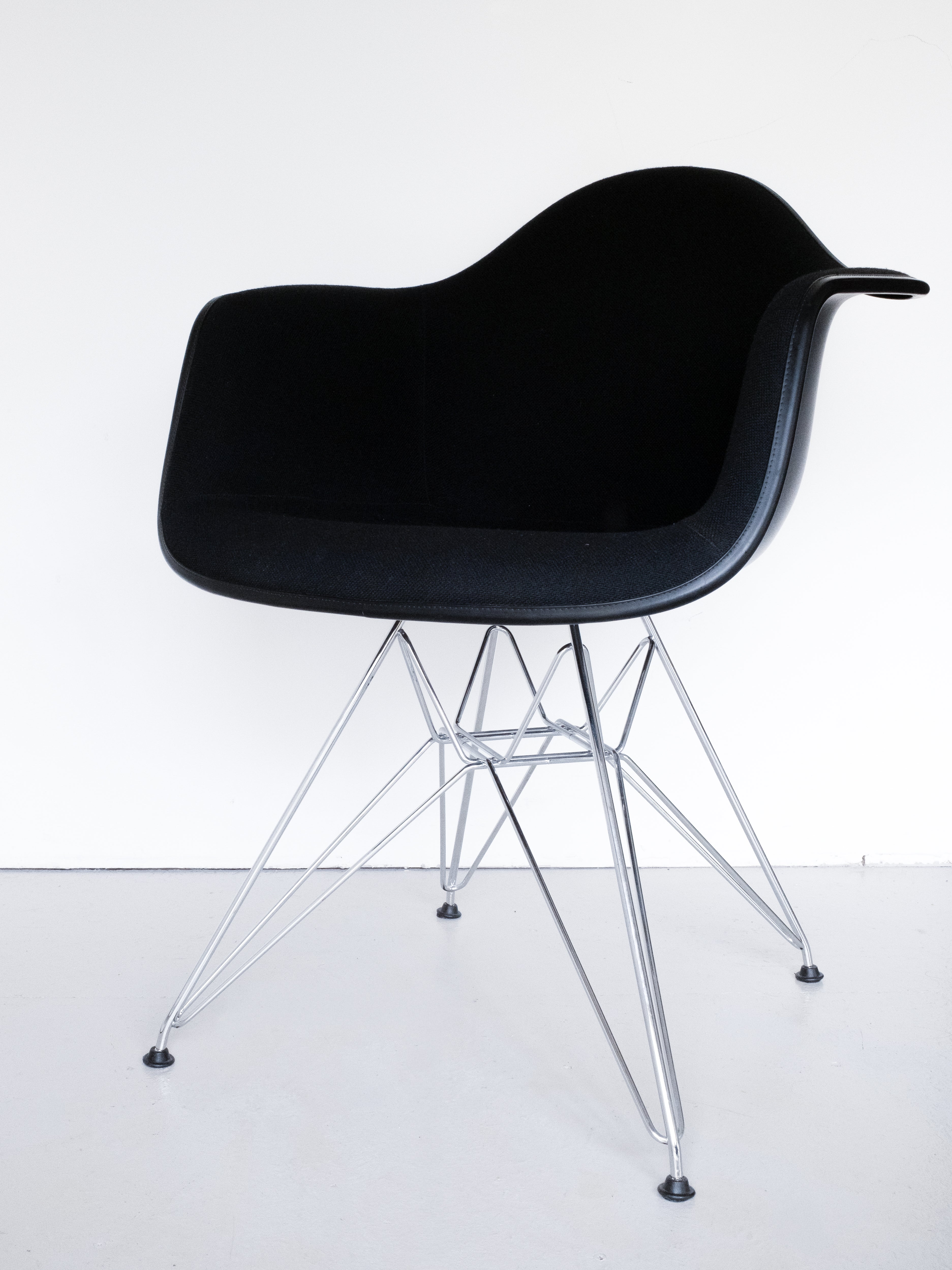 Eames Plastic Armchair DAR by Charles and Ray Eames for Vitra, 3/4 side profile, black velvet with chrome legs, mid-century modern design