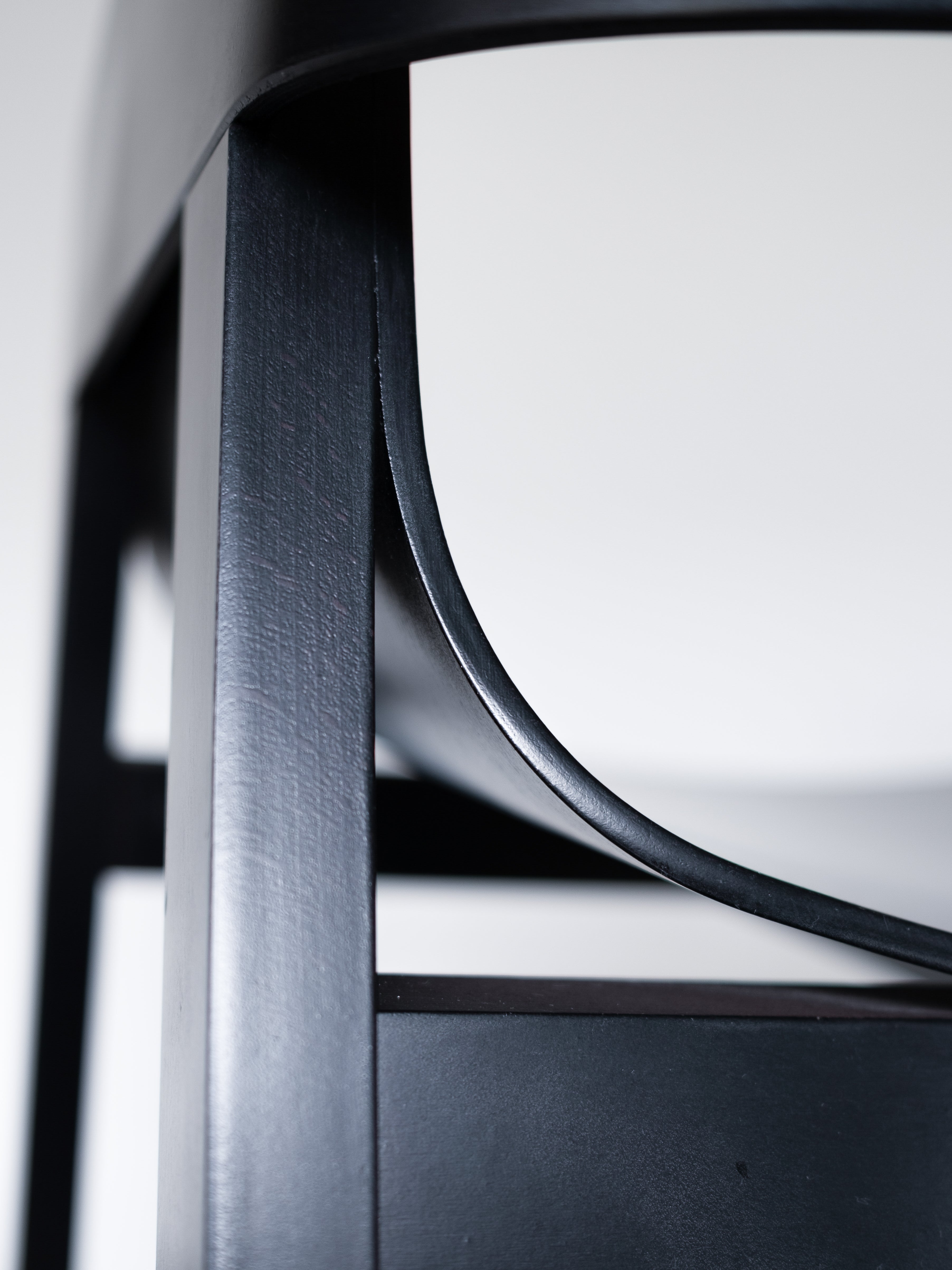 Merano Armchair armrest and frame join, seamless bentwood construction, showcasing sleek curves and craftsmanship