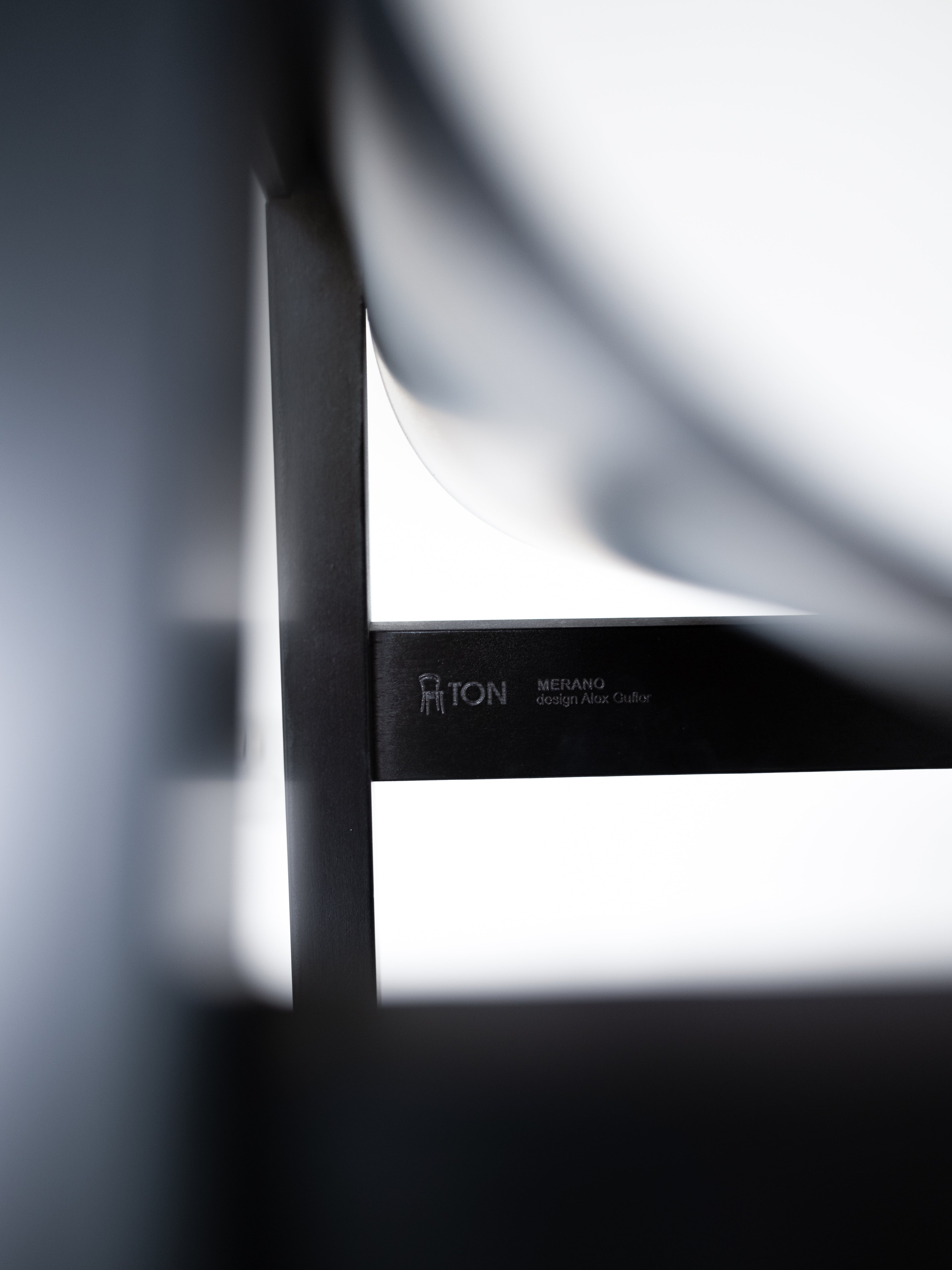 TON Merano chair by Alex Gufler, sleek black design with minimalist aesthetic