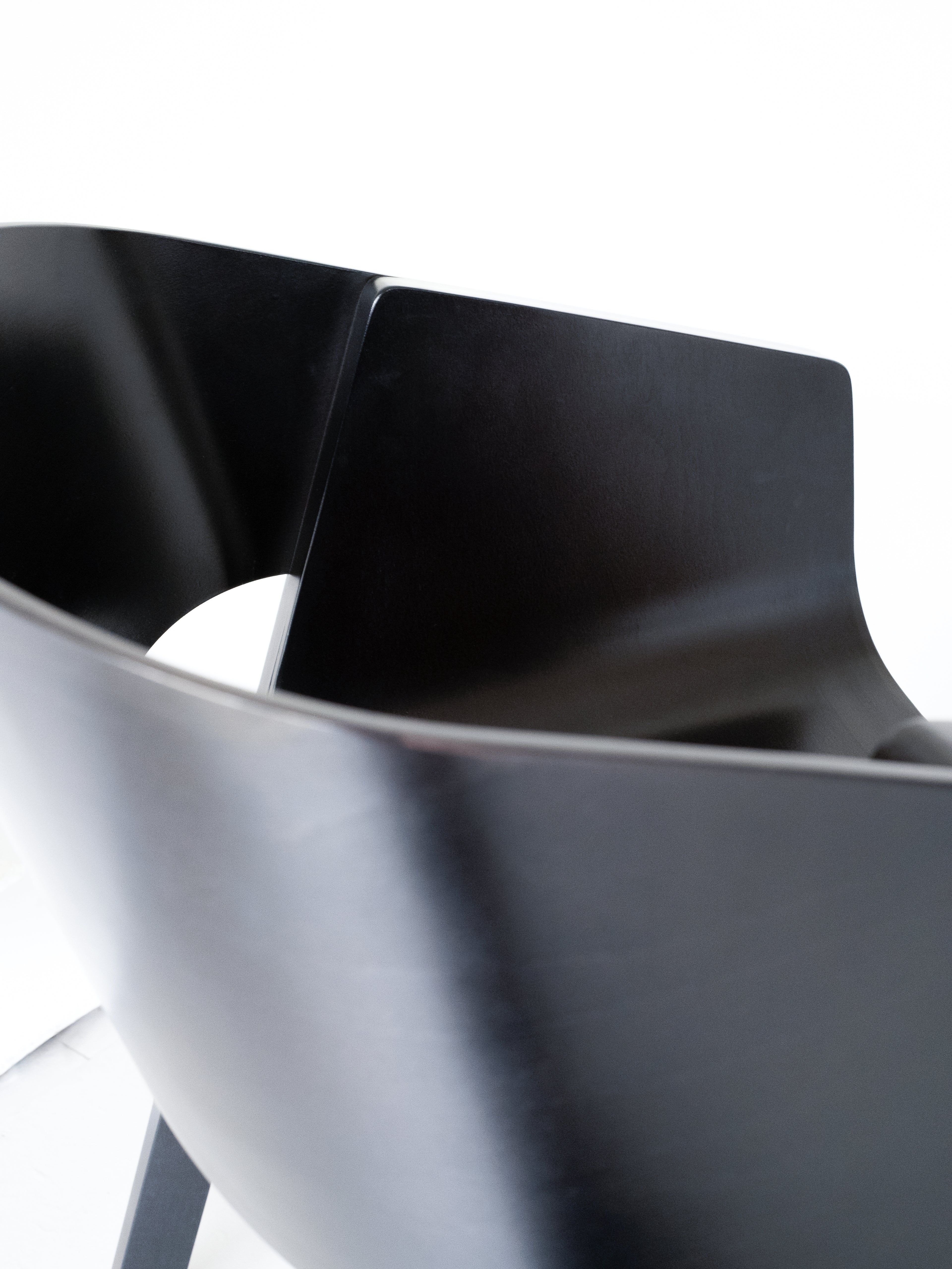 Merano Armchair seat and backrest detail, 100% beech wood, black stained, sleek design, minimalist aesthetic