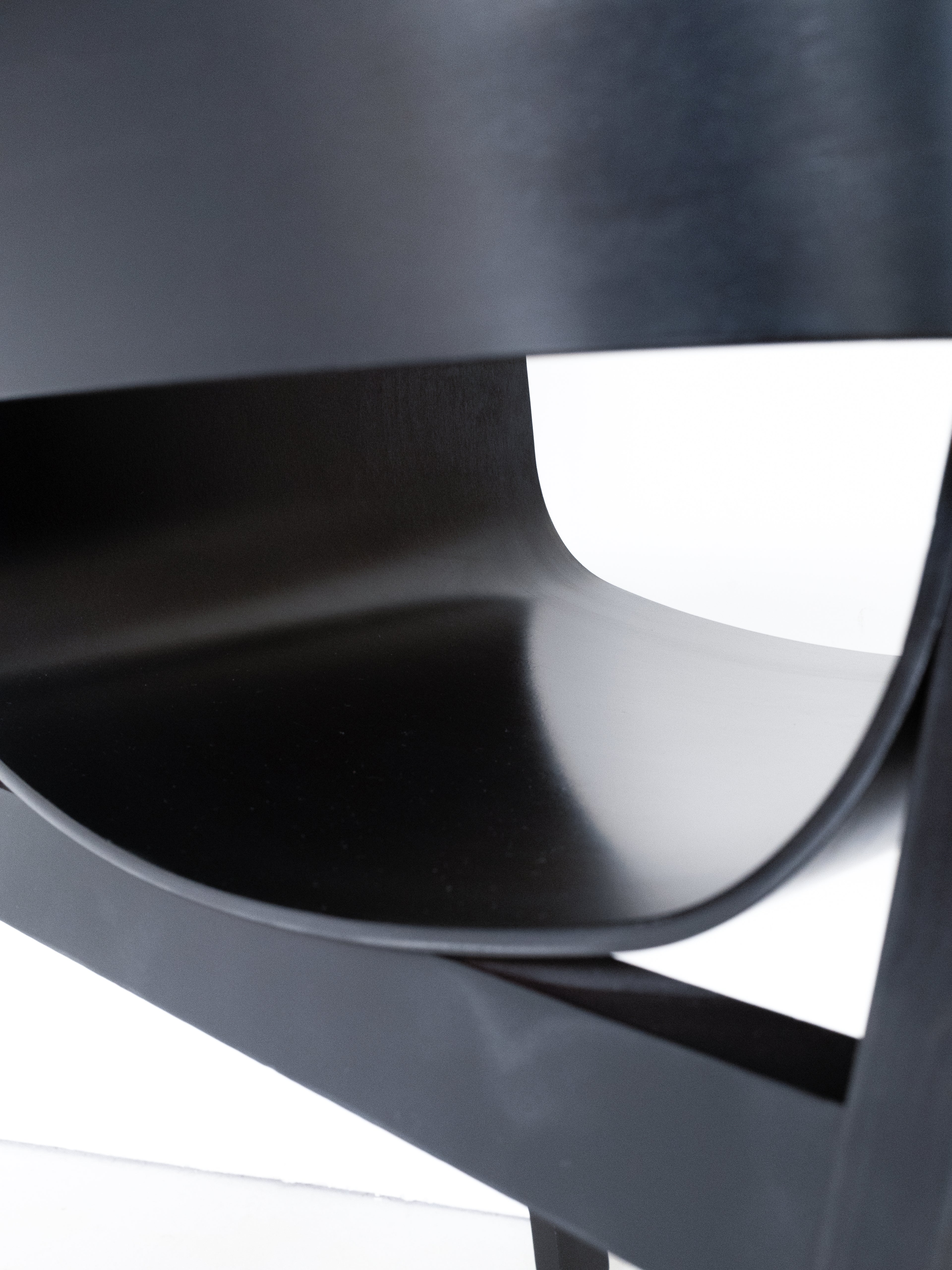 Merano Armchair seat and backrest detail, 100% beech wood, black stained, sleek curved design, sustainable vintage furniture